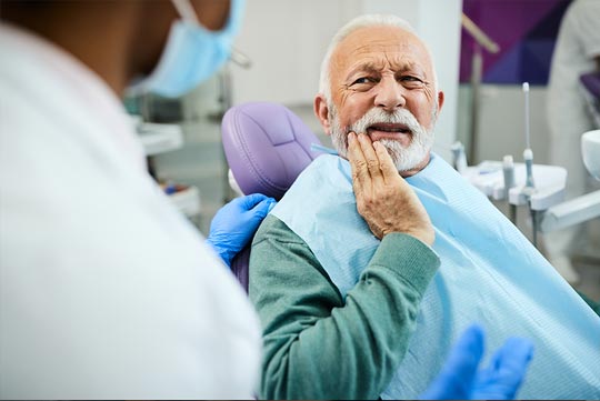 emergency discount dental plan thumbnail - patient clenching jaw in pain